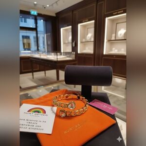 Kurt Geiger Gold Bracelet with Rainbow Gemstones